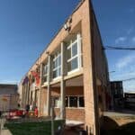 Edificio desde la esquina web Instalación de aislamiento térmico mediante insuflado en cámara de aire