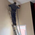 Paredes del salon de actos Instalación de aislamiento térmico mediante insuflado en cámara de aire